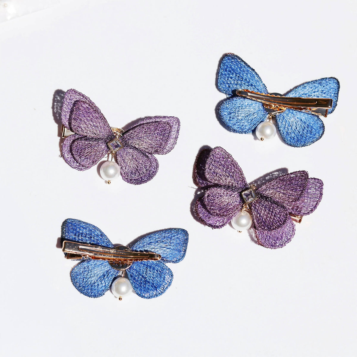 Wisteria Sapphire Butterfly Pearl Drop Hair Clips (4-Piece) Hair Clips JewelryBlossom #flowerjewelry# #weddingjewelry# #bridaljewelry# #weddinggift# #bridemaidgift##giftforher# #mothergift# #daughtergift# #birthdaygift# #anniversarygi
